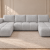 Chłodnoszara sofa bouclé w salonie Narożnik z funkcją spania i pojemnikiem Milo U szary boucle