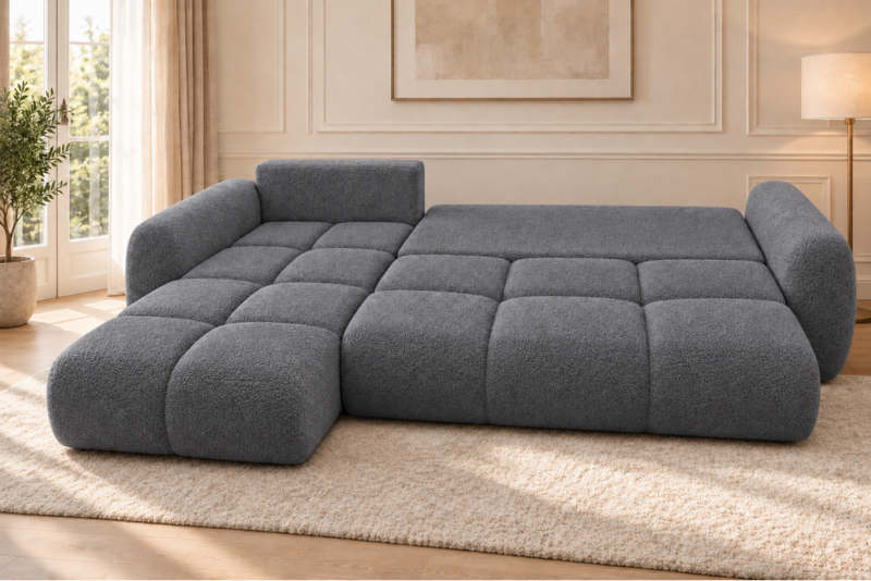 Grafitowa rozkładana sofa w jasnym salonie Narożnik z funkcją spania i pojemnikiem Milo lewy ciemnoszary boucle