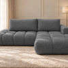 Grafitowa sofa L w eleganckim wnętrzu Narożnik Soffy prawostronny z funkcją spania i pojemnikiem ciemnoszary boucle