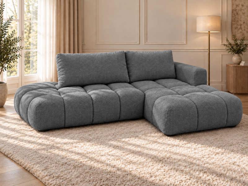 Grafitowa sofa w ciepłym wnętrzu Narożnik Soffy prawostronny z funkcją spania i pojemnikiem ciemnoszary boucle