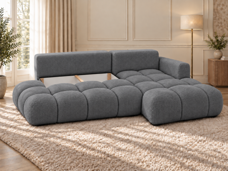 Grafitowa sofa w jasnym salonie Narożnik Soffy prawostronny z funkcją spania i pojemnikiem ciemnoszary boucle