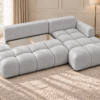 Jasnoszara sofa narożna w słonecznym salonie Narożnik Soffy prawostronny z funkcją spania i pojemnikiem szary boucle