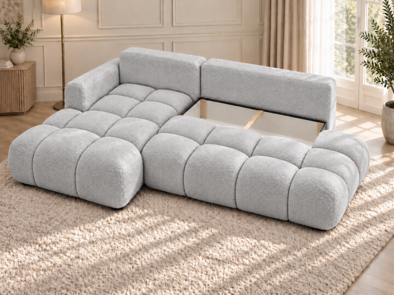 Jasnoszara sofa narożna w słonecznym salonie_LEWY Narożnik Soffy lewostronny z funkcją spania i pojemnikiem szary boucle
