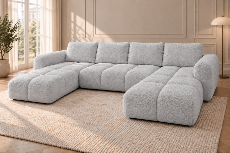 Jasnoszara sofa w ciepłym wnętrzu Narożnik z funkcją spania i pojemnikiem Milo U szary boucle