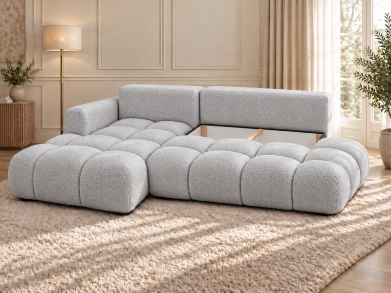 Jasnoszara sofa w eleganckim wnętrzu_LEWY Narożnik Soffy lewostronny z funkcją spania i pojemnikiem szary boucle
