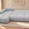 Jasnoszara sofa w funkcji spania Narożnik z funkcją spania i pojemnikiem Milo lewy szary boucle
