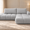 Jasnoszara sofa w słonecznym salonie Narożnik Soffy prawostronny z funkcją spania i pojemnikiem szary boucle