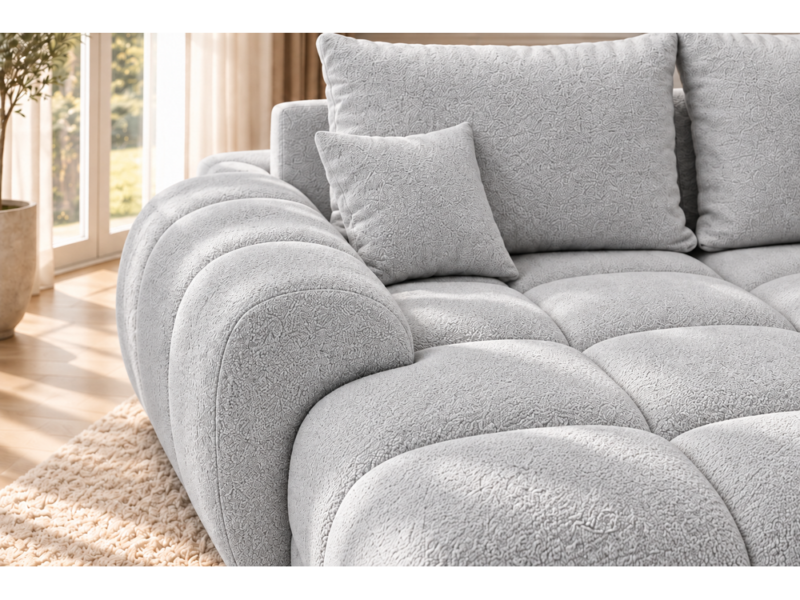 Jasnoszara sofa w słonecznym wnętrzu Narożnik z funkcją spania i pojemnikiem Aurio lewy szary boucle