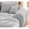Jasnoszara sofa w słonecznym wnętrzu_PRAWY Narożnik z funkcją spania i pojemnikiem Aurio prawy szary boucle