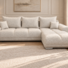 Kremowa sofa boucle w eleganckim salonie_PRAWY Narożnik z funkcją spania i pojemnikiem Aurio prawy kremowy boucle
