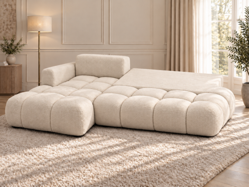 Kremowa sofa modułowa w miękkim świetle_LEWY Narożnik Soffy lewostronny z funkcją spania i pojemnikiem kremowy boucle