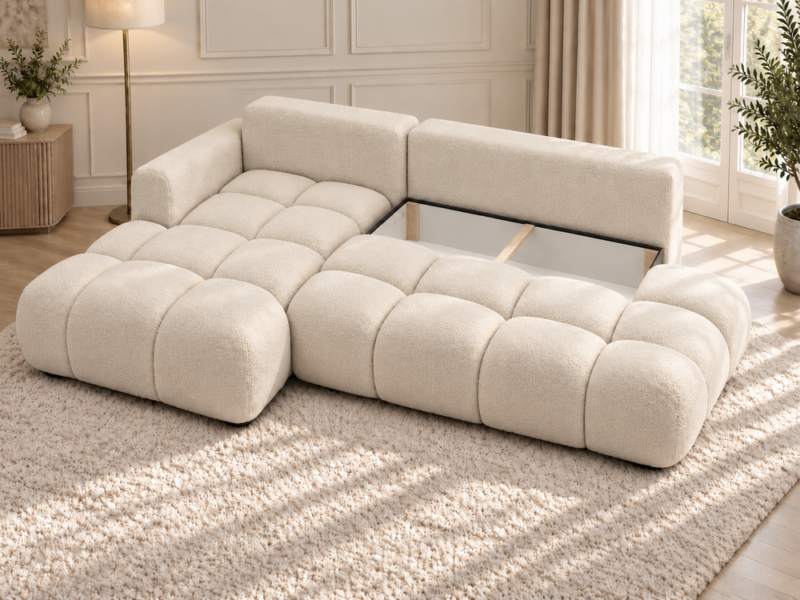 Kremowa sofa w miękkim świetle_LEWY Narożnik Soffy lewostronny z funkcją spania i pojemnikiem kremowy boucle