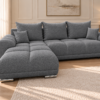 Neutralnoszara sofa boucle w salonie Narożnik z funkcją spania i pojemnikiem Aurio lewy ciemnoszary boucle