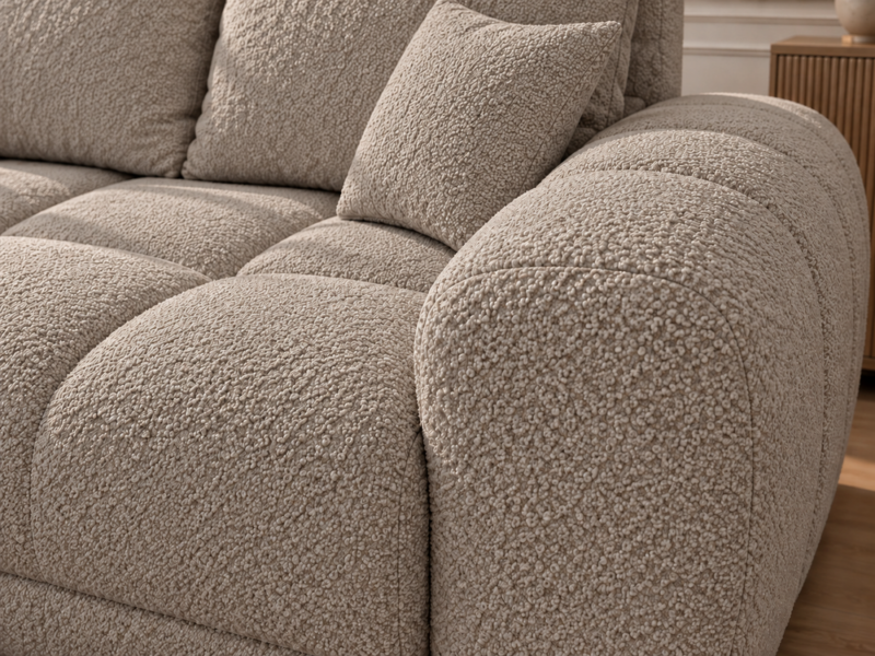 Sofa boucle w ciepłym odcieniu taupe Narożnik z funkcją spania i pojemnikiem Aurio lewy beżowy boucle