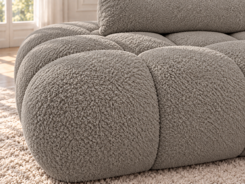 Sofa bouclé w ciepłym szarobeżu Narożnik Soffy prawostronny z funkcją spania i pojemnikiem beżowy boucle
