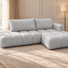 Szara pikowana sofa w słonecznym salonie Narożnik Soffy prawostronny z funkcją spania i pojemnikiem szary boucle