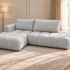Szara pikowana sofa w słonecznym salonie_LEWY Narożnik Soffy lewostronny z funkcją spania i pojemnikiem szary boucle