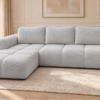 Szara sofa w ciepłym salonie Narożnik z funkcją spania i pojemnikiem Milo lewy szary boucle