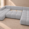 U-kształtna sofa w jasnoszarej tapicerce Narożnik z funkcją spania i pojemnikiem Milo U szary boucle