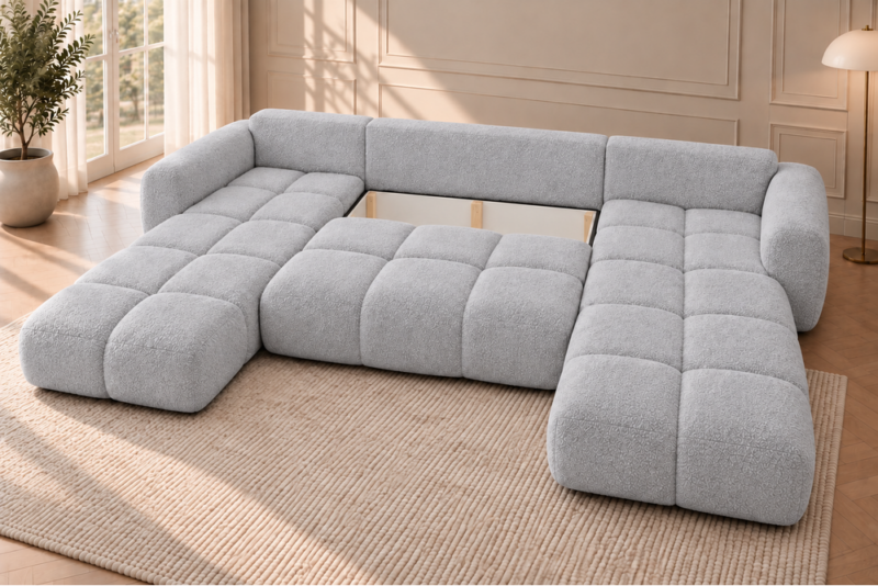 U-kształtna sofa w jasnoszarej tapicerce Narożnik z funkcją spania i pojemnikiem Milo U szary boucle